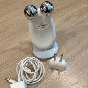 NUFACE facial toning tool with eye and lip attachment